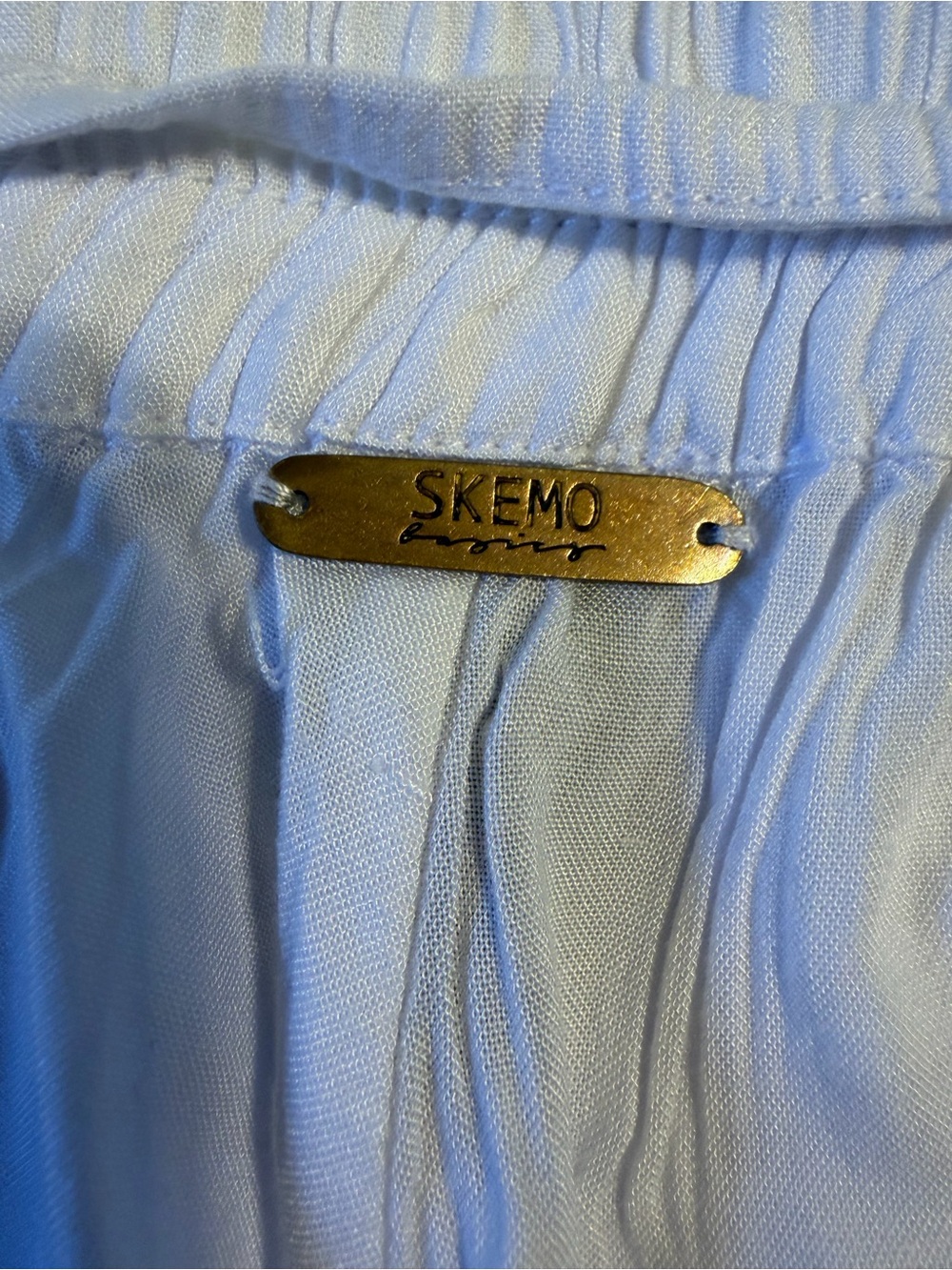 Skemo White Skort with Gold Logo Plate